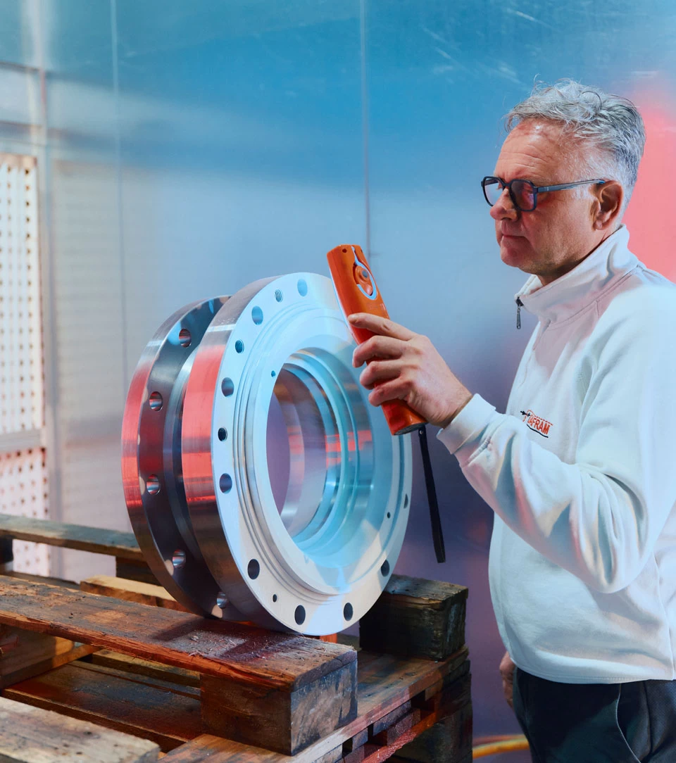 Dafram technician inspecting an industrial valve during quality control and advanced ball valve testing services
