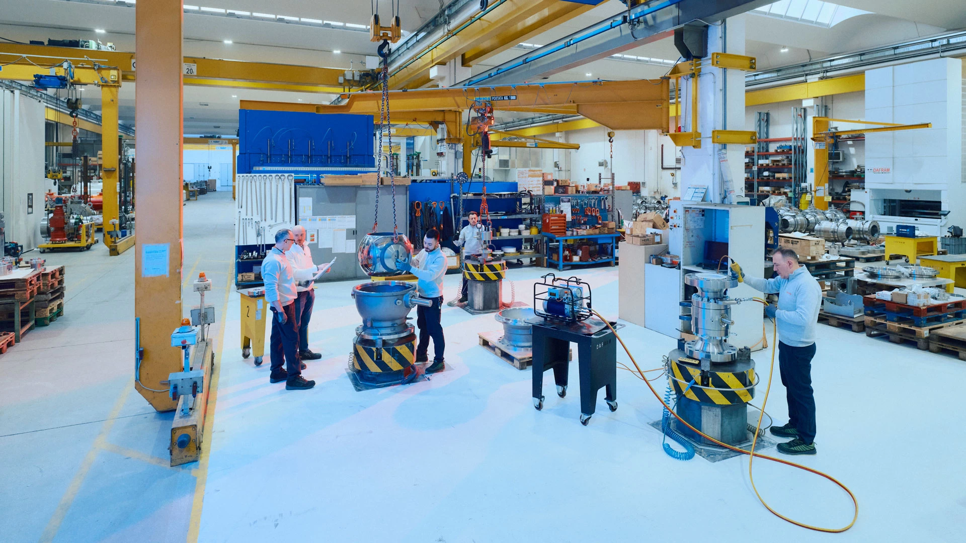 Dafram production department with technicians working on ball valves for the oil and gas industry