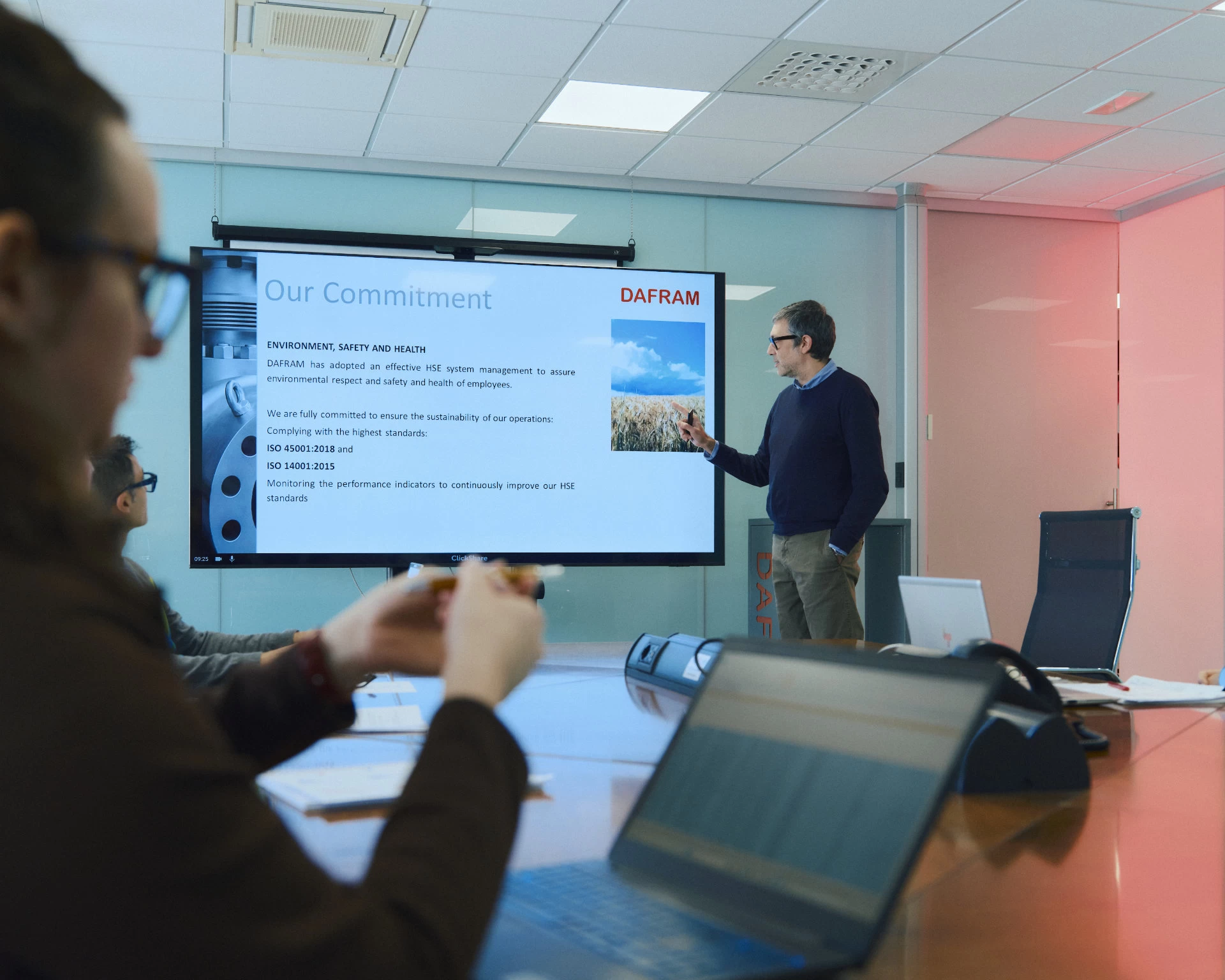 Corporate training session with a presentation on safety, environment and professional development